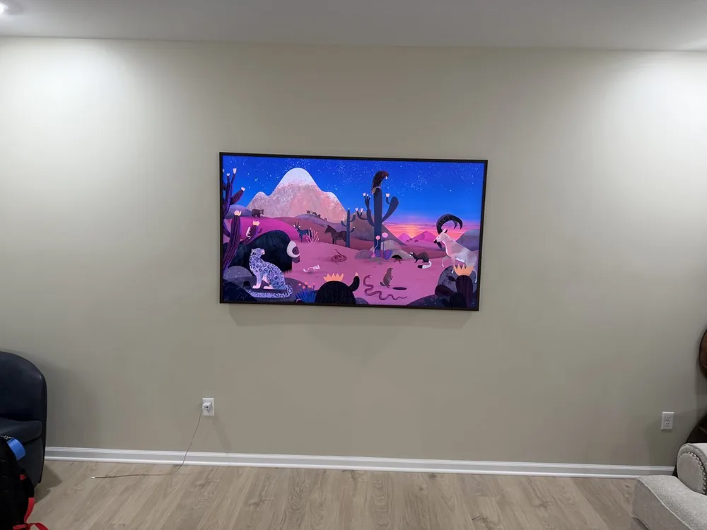 65 inch Samsung Frame Pro on a living room wall