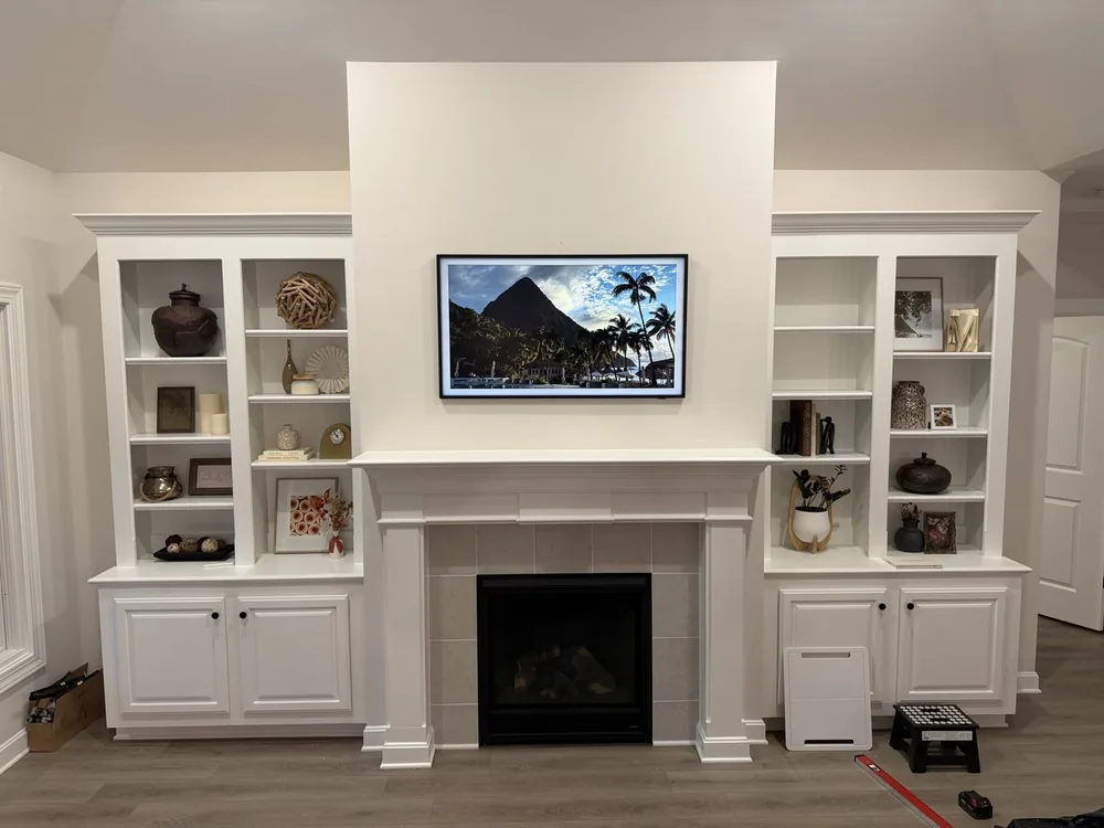 How High Should a TV Be Mounted Above a Fireplace? 50 inch Samsung Frame above a white fireplace in Prospect, Kentucky