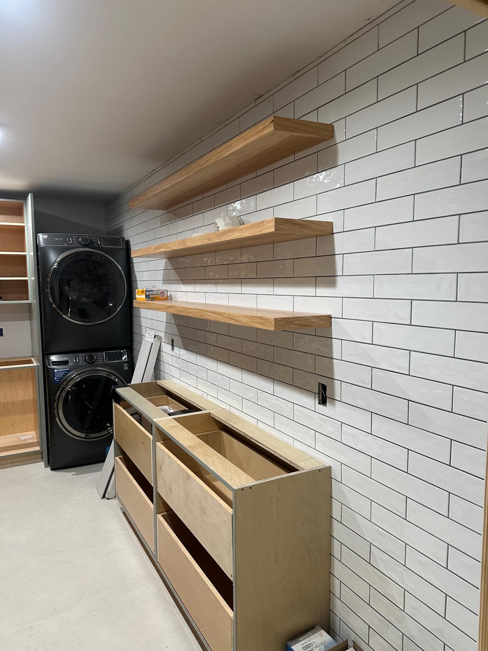 Wall-mounted floating shelves showcasing decor and functionality