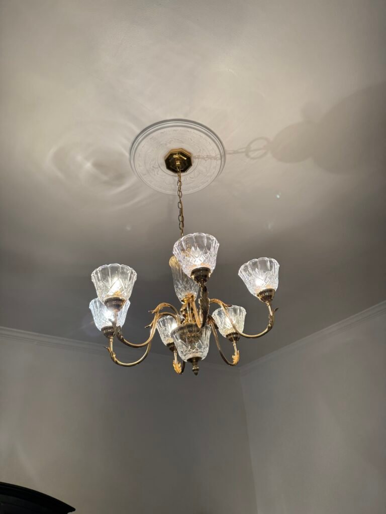 Professional chandelier installation completed by Javi with precise alignment and clean finish