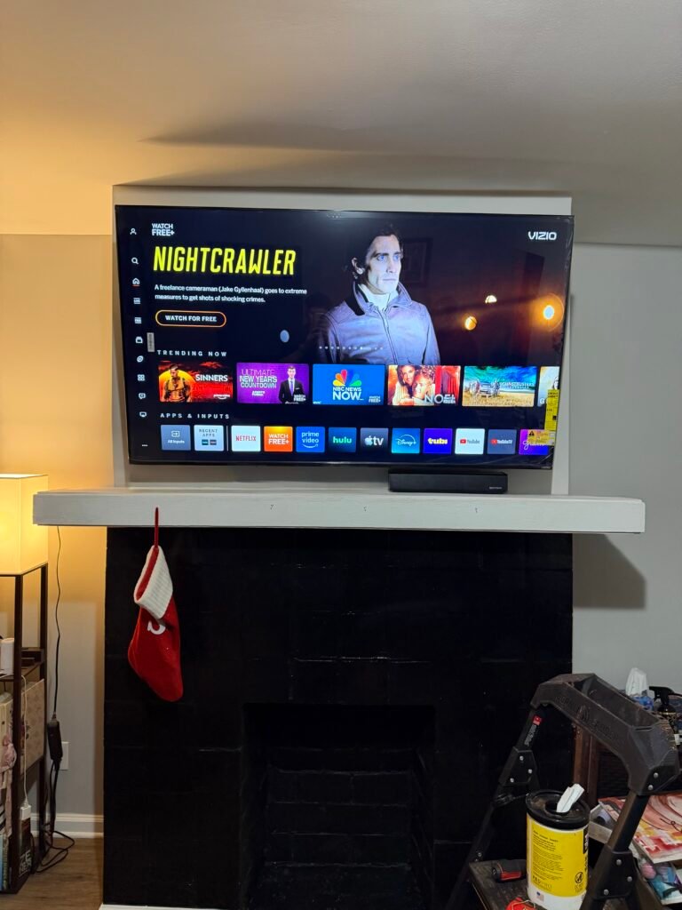 TV mounted above fireplace in St. Matthews KY on a brick wall with clean and secure installation
