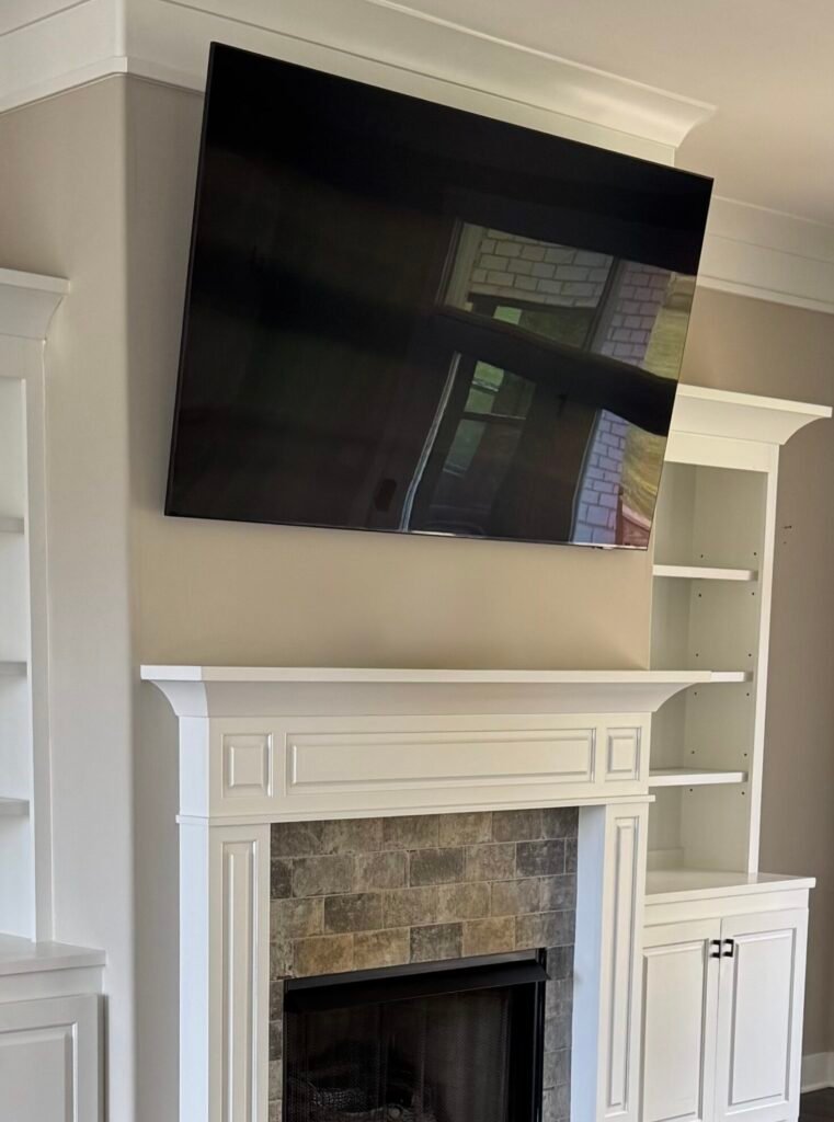 Above fireplace TV installation in Prospect KY Above fireplace TV mounting in Prospect KY with hidden wires and clean finish