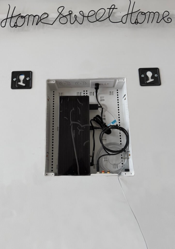 Samsung One Connect Box installed inside recessed wall box before TV mounting, wires fully hidden, flush mount setup in Prospect KY