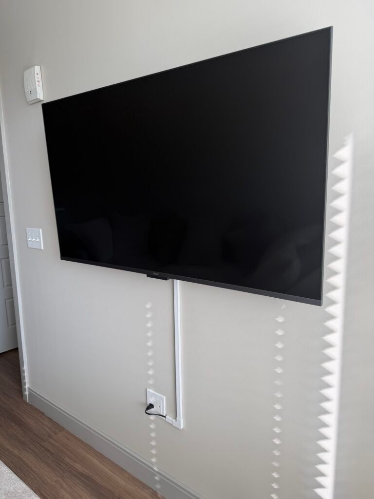 TV Installed with cable raceway for hidden cords rental friendly installation