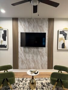 TV mounted against a decorative slat wall