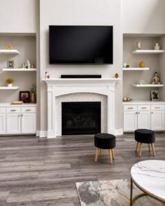 TV above a fireplace with built-in cabinets