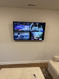 TV mounted on a painted living room wall