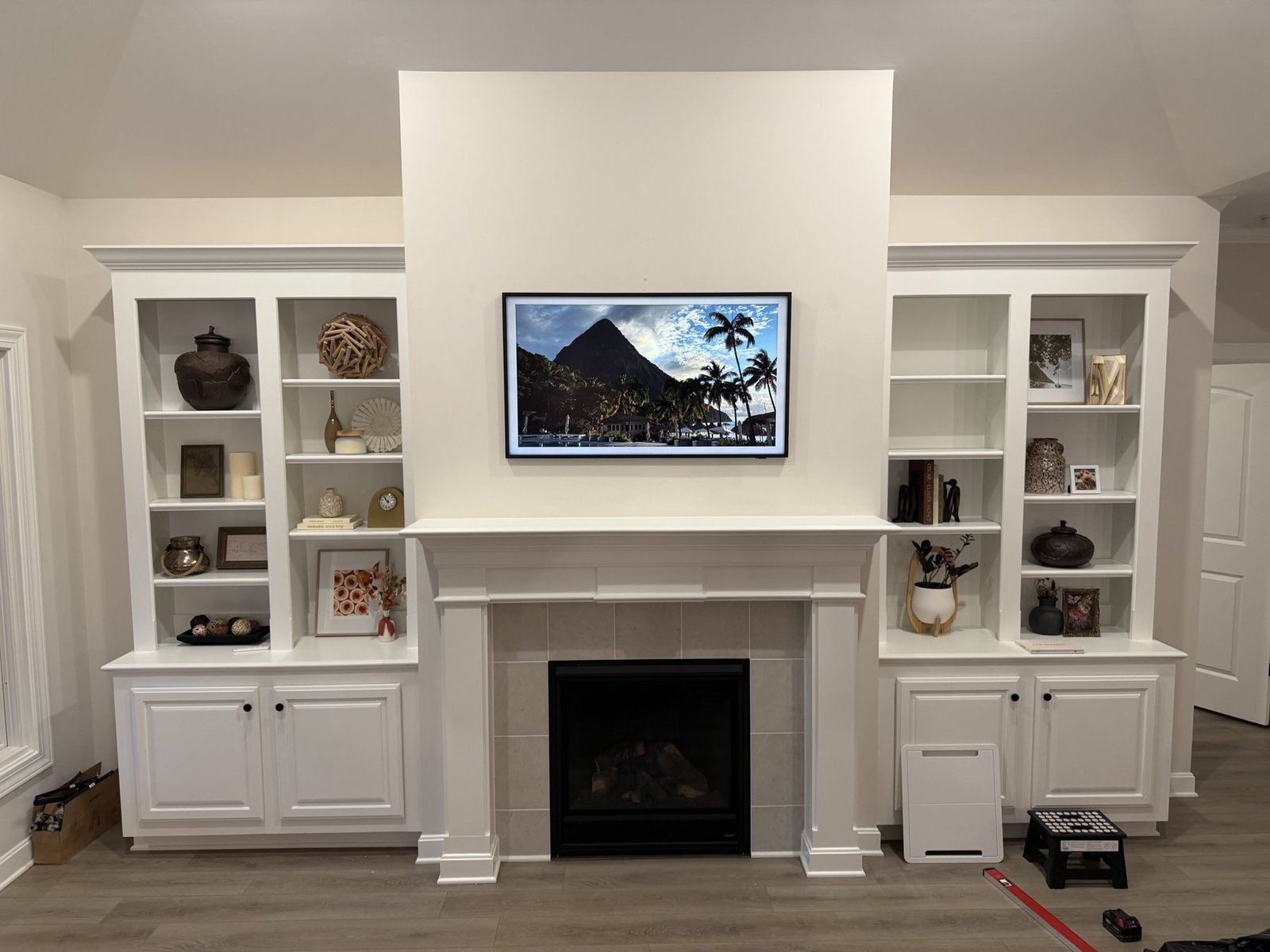 TV Mounting in Prospect, KY 50-inch Samsung Frame above a white fireplace with built-in shelves in Prospect, Kentucky